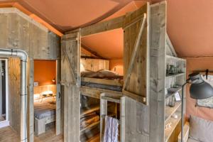 a room with two bunk beds in it at Camping LA SERRE in Aigues-Vives +129 photos