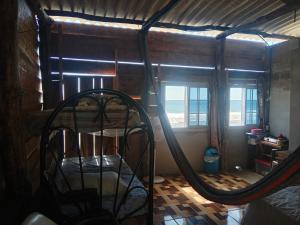 a room with a bed and a mirror at Ranchito Cornejo in La Esmeralda
