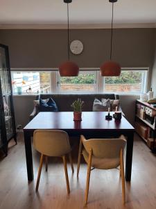 a dining room with a table and two chairs at 2 minute walk from ONS exhibiton area in Stavanger