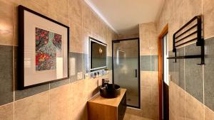 a bathroom with a sink and a mirror at L'Ostal de Soubrey in Salettes +45 photos