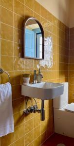 a bathroom with a sink and a mirror at Casa Terra in Rio Maior +11 photos