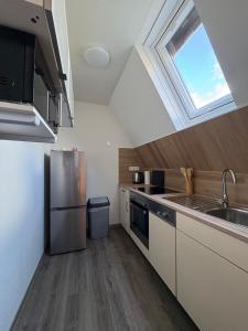 a kitchen with a sink and a skylight at Ferienhaus in Marl