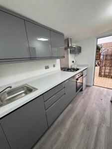 a kitchen with a sink and a counter top at Newly refurbished Annexe in Wareham