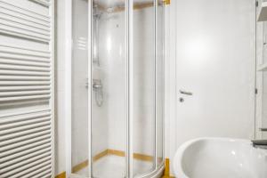 a bathroom with a shower and a sink at Windshouse Apartments in Nago-Torbole +43 photos