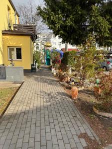 a brick sidewalk in front of a house at Hellwig Ferienwohnung 5 in Bernburg +9 photos