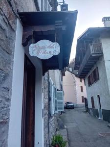 a sign hanging from the side of a building at Oasi del relax in Scopello