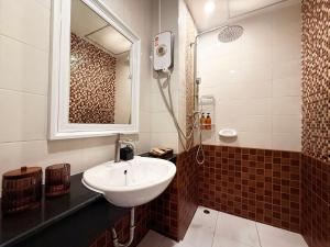 a bathroom with a sink and a shower at THE MAISON Phuket in Ban Lo Long +16 photos