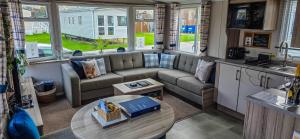 a living room with a couch and a table at K&S at 1529 in Selsey