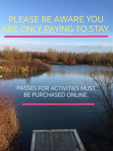 a sign that says please be aware you are only paying to stay on a lake at Dog Friendly Holiday Home in Northampton