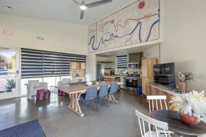 a kitchen and dining room with a table and chairs at Webber East in Austin
