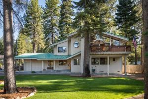 a house with a clock on the side of it at Sandy Shores Villa in Tahoe Vista