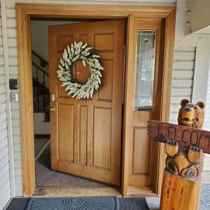 a wooden door with a welcome sign in front of it at Sandy Shores Villa in Tahoe Vista