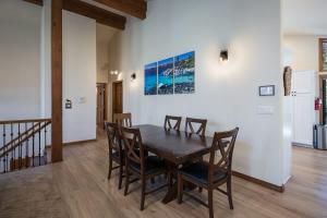 a dining room with a wooden table and chairs at Sandy Shores Villa in Tahoe Vista +31 photos