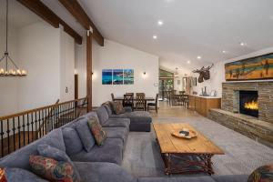 a living room with a couch and a fireplace at Sandy Shores Villa in Tahoe Vista