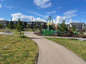 a park with a playground with a roller coaster at Bedroom in the basement Upland F in Edmonton