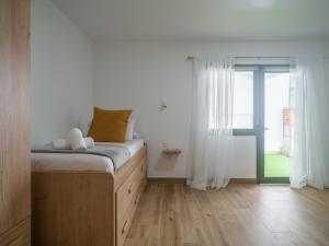 a bedroom with a bed and a large window at Aguadulce Agaete 1A in Agaete