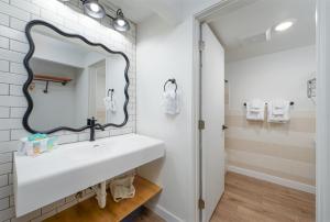 a bathroom with a white sink and a mirror at Varsity North in Centralia +21 photos