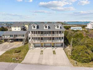 an aerial view of a large house with a yard at Oceanwalk in Atlantic Beach