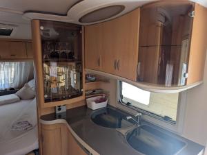 a kitchen with a sink in an rv at Charming Mobile Home Retreat in Ebbs, Austria - Tranquil Escape in Ebbs