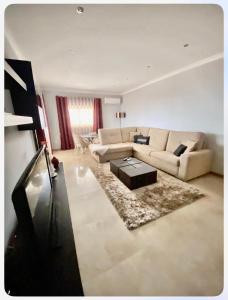 a living room with a couch and a table at Casa Encosta do Marao in Amarante