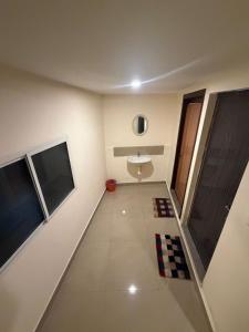 a bathroom with a sink and a toilet at Bliss Stay in Mūvattupula
