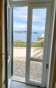 an open door with a view of the ocean at Villa Ersilia in Ponza