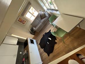 an overhead view of a living room with a table and chairs at La Garçonnière in Colombier