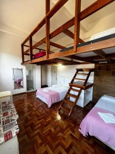 two bunk beds in a room with wooden floors at DM Thermas Hotel Iraí in Iraí +108 photos