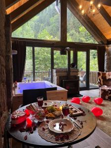 a table with food on it in a living room at AYDER VANAK SUİTEs in Ayder Yaylasi