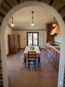 a kitchen with a table and chairs in a room at Residence Martina in Marina di Camerota