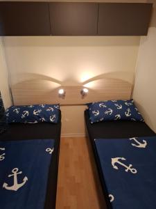 a room with two beds in a room at Villa Petra 1 in Vodice +53 photos