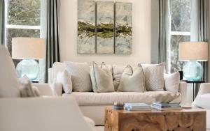 a living room with a white couch and a table at Ritz Clareon by Oversee 30A in Seacrest +56 photos