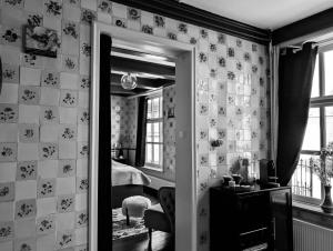 a room with a mirror and a bedroom with a bed at De Tegel Suite in Anjum +34 photos