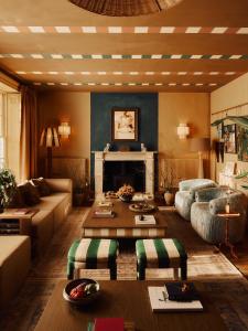 a living room with a couch and a table at Crafted at Powdermills in Battle +96 photos