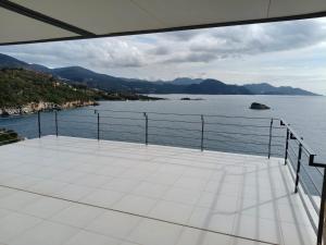a balcony with a view of the water at Villa Oikos in Syvota