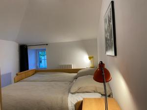 Rúm í herbergi á Appartement duplex