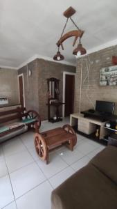 a living room with a couch and a table at Sitio Mãe Rainha in Petrolina