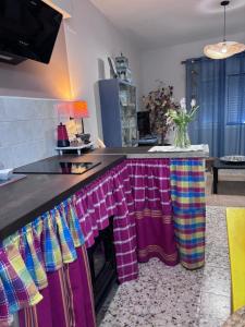a kitchen with a counter with colorful towels on it at Henko-Alloza in Alloza