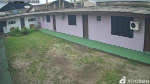 a house with a yard in front of it at Fênix in Porto Velho