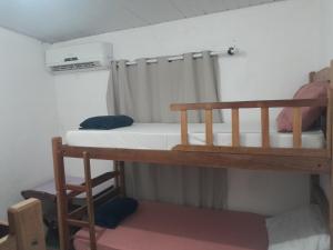 a bedroom with two bunk beds in a room at Fênix in Porto Velho