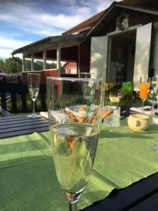 a glass of water sitting on top of a table at Sättraby villa in Norrtälje