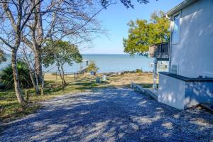 a house with a view of the water at Salty Bay Hideaway in Gulf Breeze