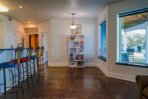 a dining room with chairs and a table at Salty Bay Hideaway in Gulf Breeze