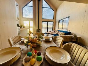 a dining room with a table with easter eggs on it at Cëchô Woda in Parchowo