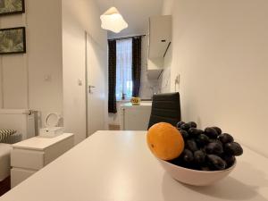 a bowl of fruit on a table in a room at Chińczyk in Inowrocław