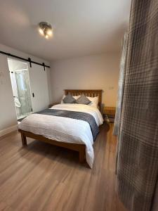 a bedroom with a large bed and a window at Meadow View in Birr