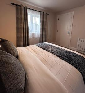 a bedroom with a large bed and a window at Meadow View in Birr
