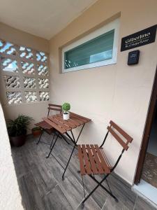 a table and two chairs sitting on a patio at Gibertino by Cinque Terre in Isabela