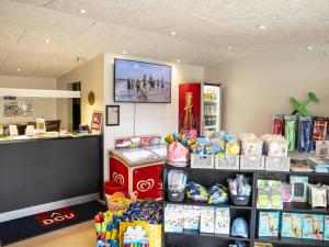 a store with a counter with a lot of products at DCU-Camping Tranum in Brovst