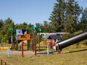 a park with a playground with a slide at DCU-Camping Tranum in Brovst